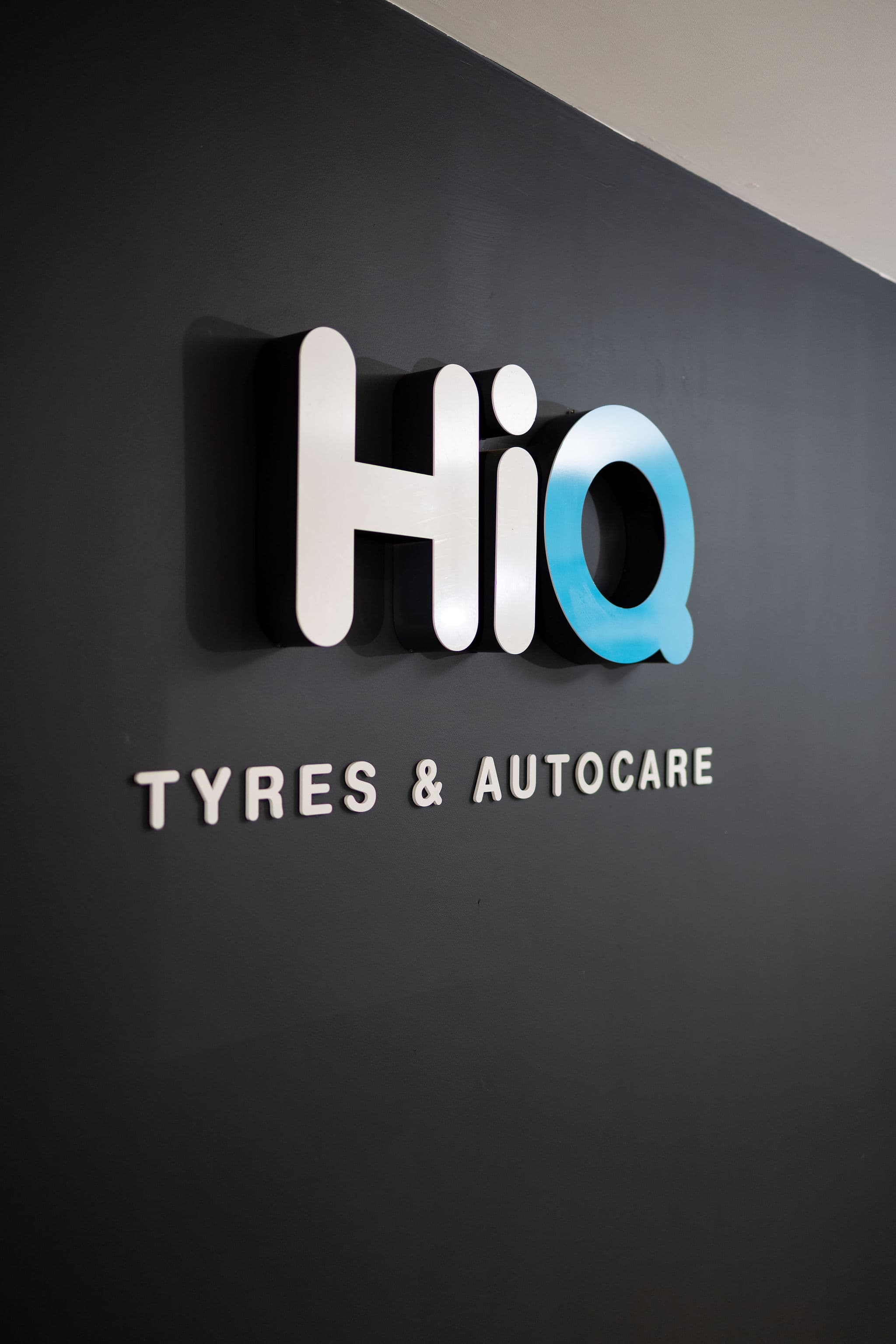 HiQ Tyres & Autocare sign in the Synergy reception